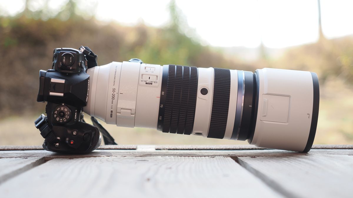The OM System M.Zuiko 50-200mm f/2.8 IS Pro lens, mounted to the OM System OM-1 Mark II, in an outdoor setting