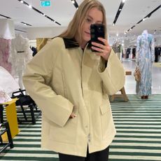 Woman wears canvas jacket from Toteme