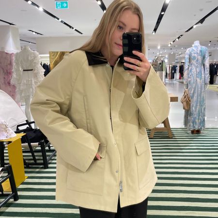 Woman wears canvas jacket from Toteme