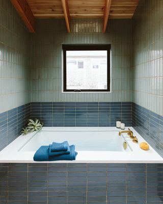 a bathroom design with artisanal tiles and beige grout