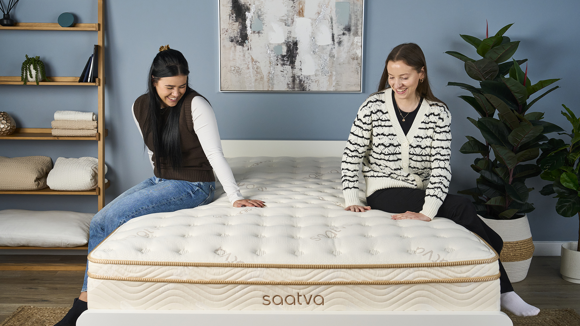 Tom&#039;s Guide Sleep Testers Eve Davies and Frances Daniels sit on the Saatva Classic luxury innerspring hybrid mattress in our Sleep Product Testing Lab while our Managing Editor of Sleep Claire Davies asks them what they think of the mattress in terms of support and comfort