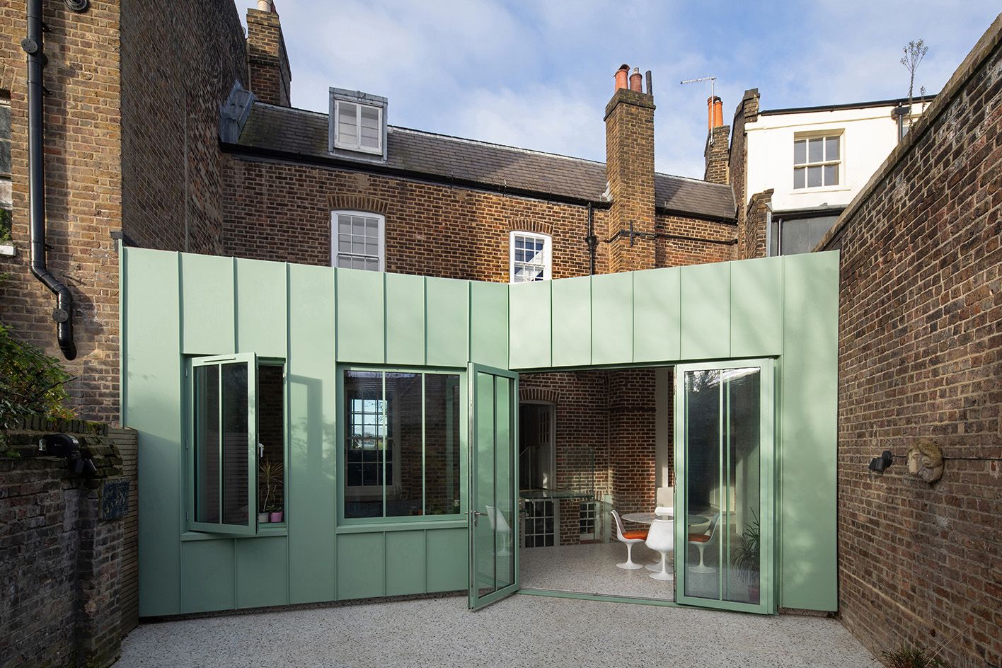 Brick house with green extension