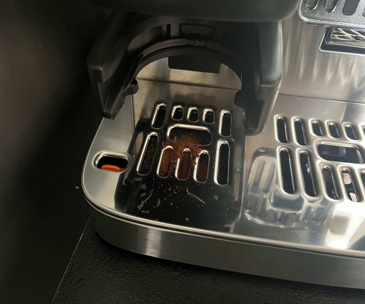 Coffee grounds on the drop tray of the ninja luxe caf&eacute; mini.