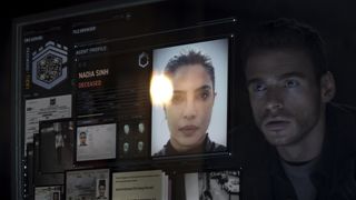 Mason stares at a computer screen that shows Nadia's file in Citadel on Prime Video