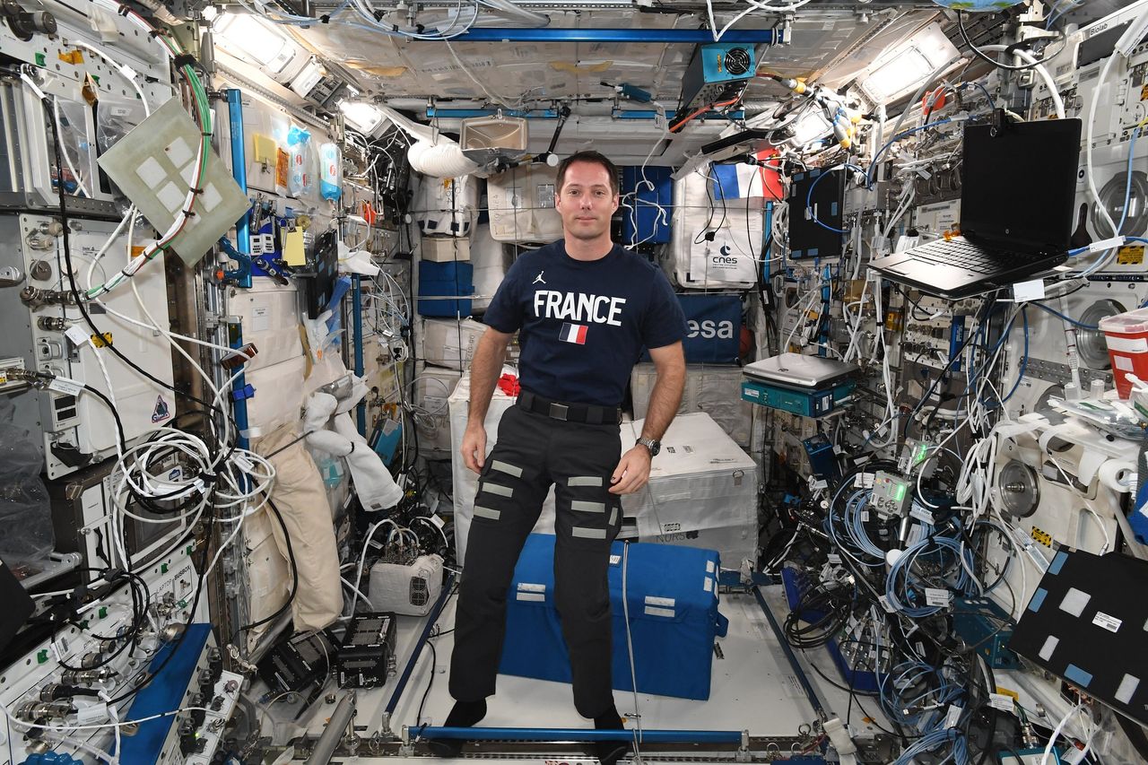 French astronaut Thomas Pesquet of the European Space Agency celebrated France's Bastille Day holiday in space with festive shirts and a meal with friends on July 14, 2021 aboard the International Space Station.