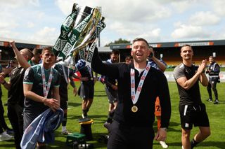 Steven Schumacher the manager / head coach of Plymouth Argyle with the EFL Sky Bet League One trophy during the Sky Bet League One between Port Vale and Plymouth Argyle at Vale Park on May 7, 2023 in Burslem, United Kingdom. (Photo by James Williamson - AMA/Getty Images)