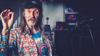 Dave Brock poses at Hawkwind HQ in a loud shirt