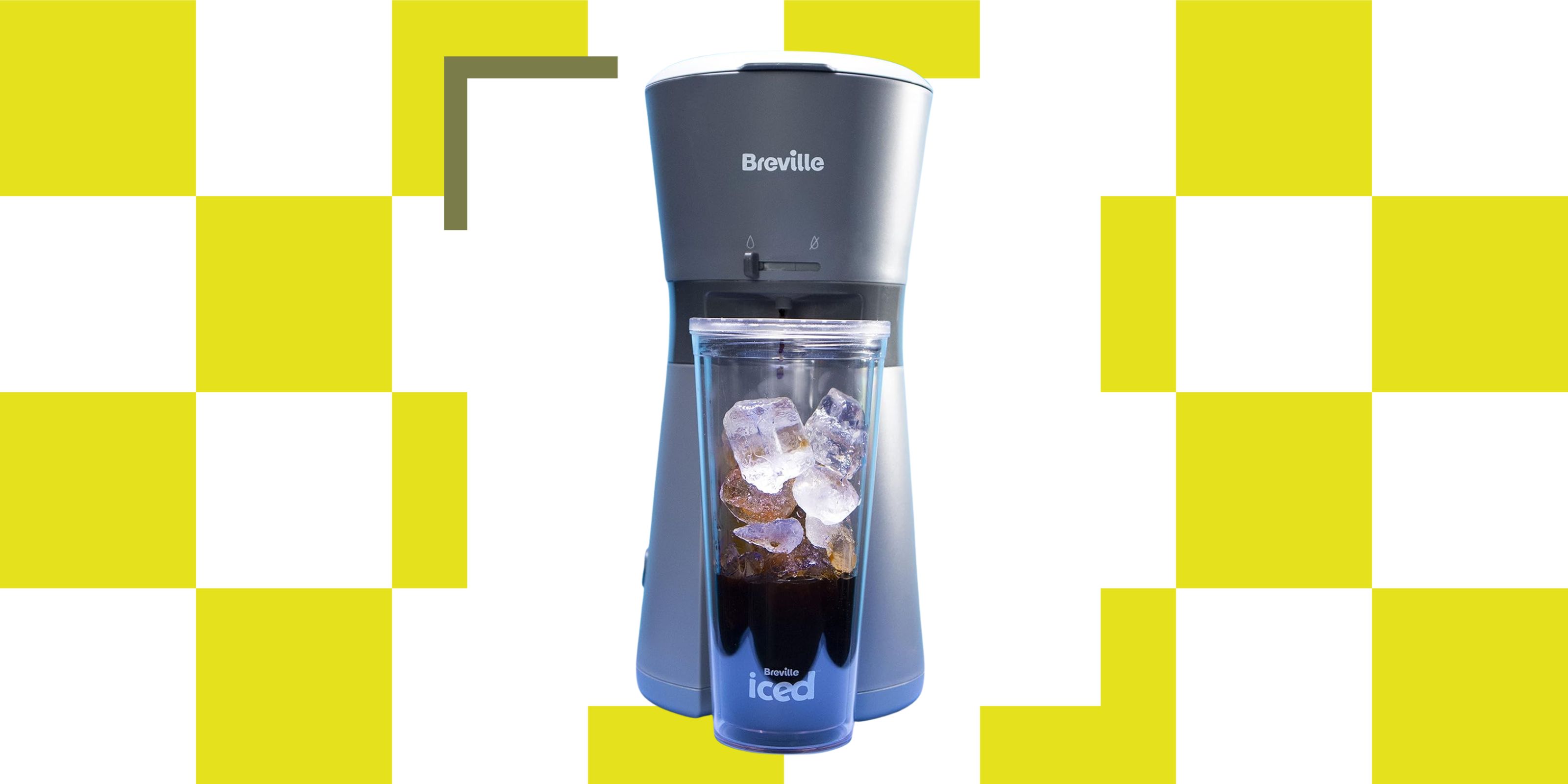 A gray and blue iced coffee maker with a cup full of iced being filled up in front of it. The coffee maker is one a neon yellow and white background. 