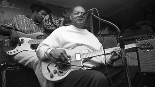 Junior Kimbrough performs at Junior’s Place, a.k.a. Junior’s Juke Joint, in Chulahoma, Mississippi, in 1999