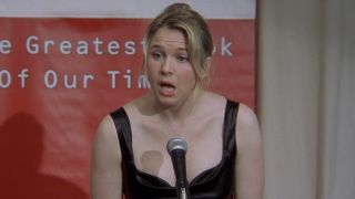 Bridget giving a speech at a microphone in Bridget Jones's Diary