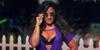Demi Lovato at a house party in music video screenshot