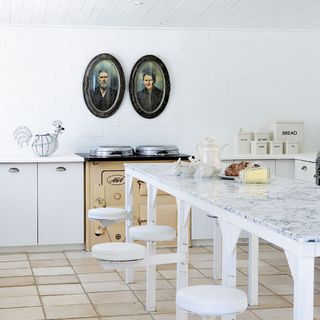 kitchen with white walls and marble countertop