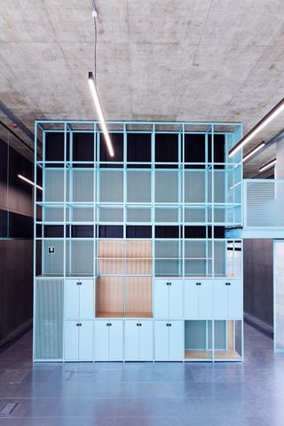 Light blue mesh lockers in an office