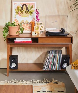 UO wooden console table with retro record player and books