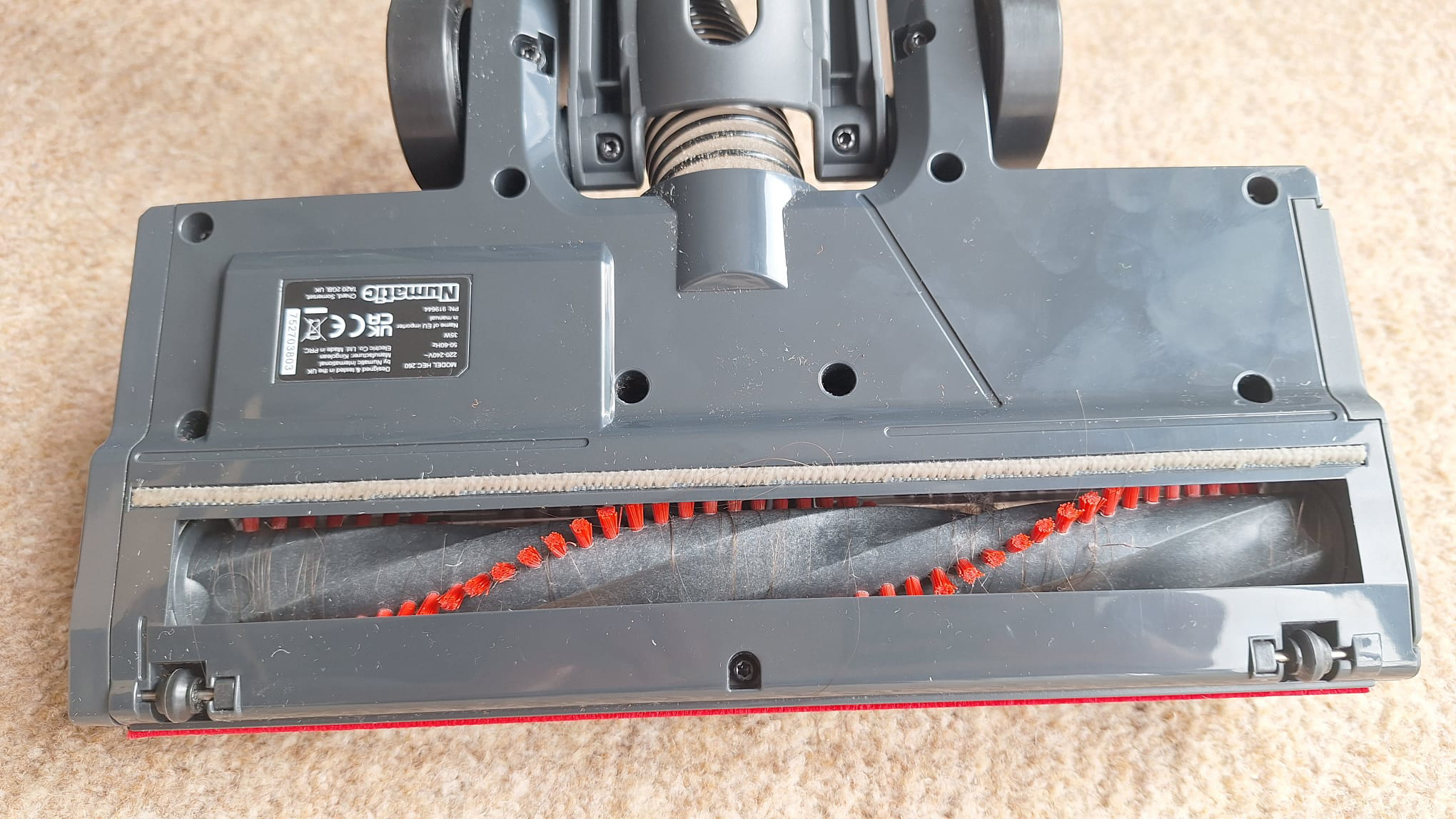 Underside of the floorhead, with hair wrapped around the roller
