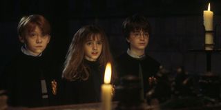 Rupert Grint, Emma Watson and Daniel Radcliffe as Ron, Hermoine and Harry in Sorcerer's Stone