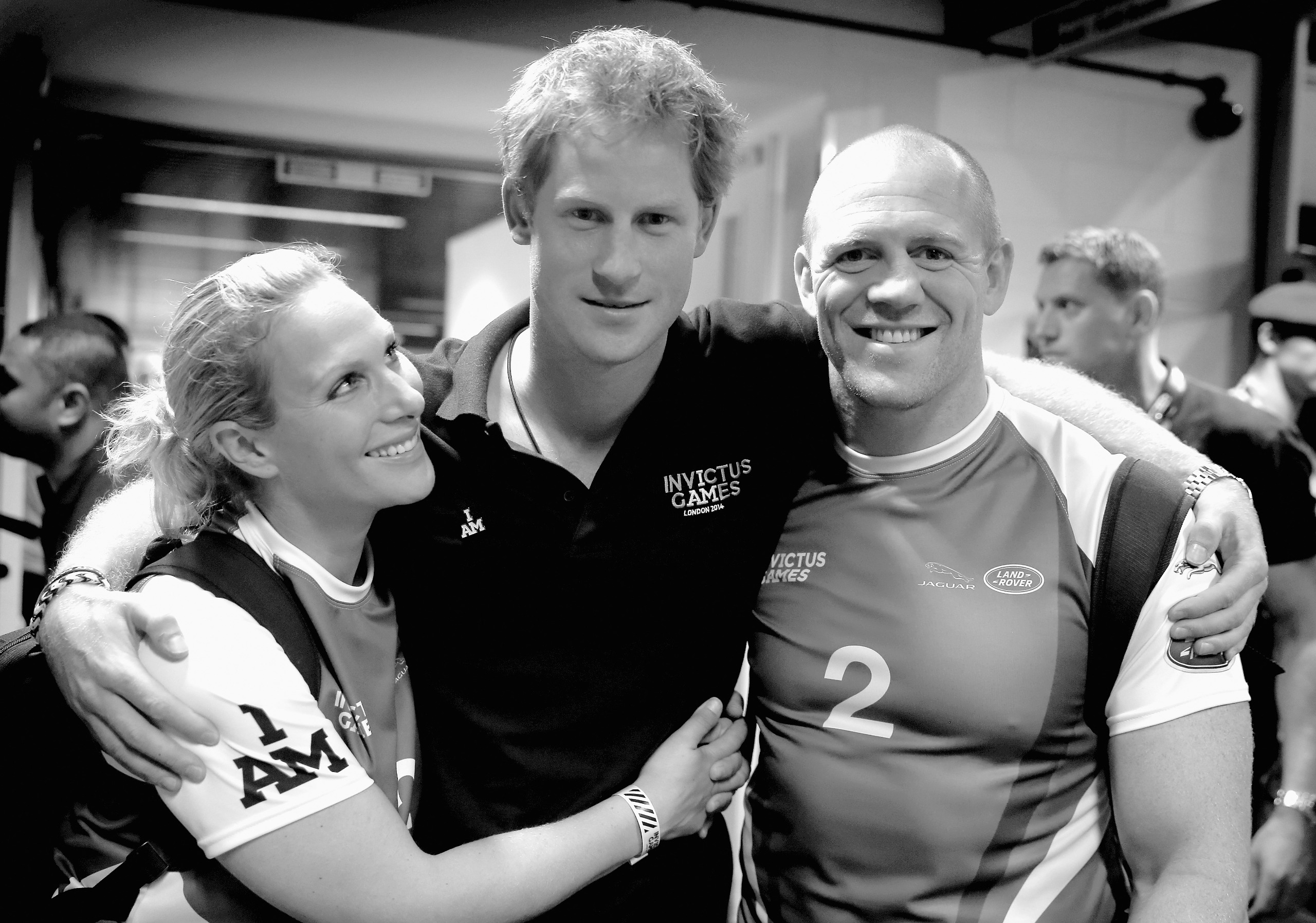 Prince Harry hugging Zara Tindall and Mike Tindall