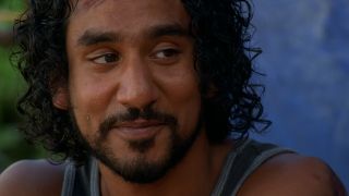 A close up of a smiling Naveen Andrews as Sayid in Lost