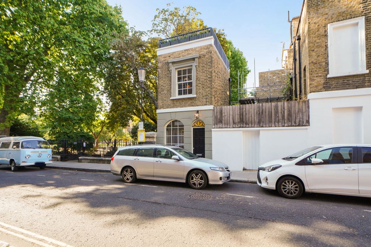 The exterior of the small Georgian home in London with yellow brick