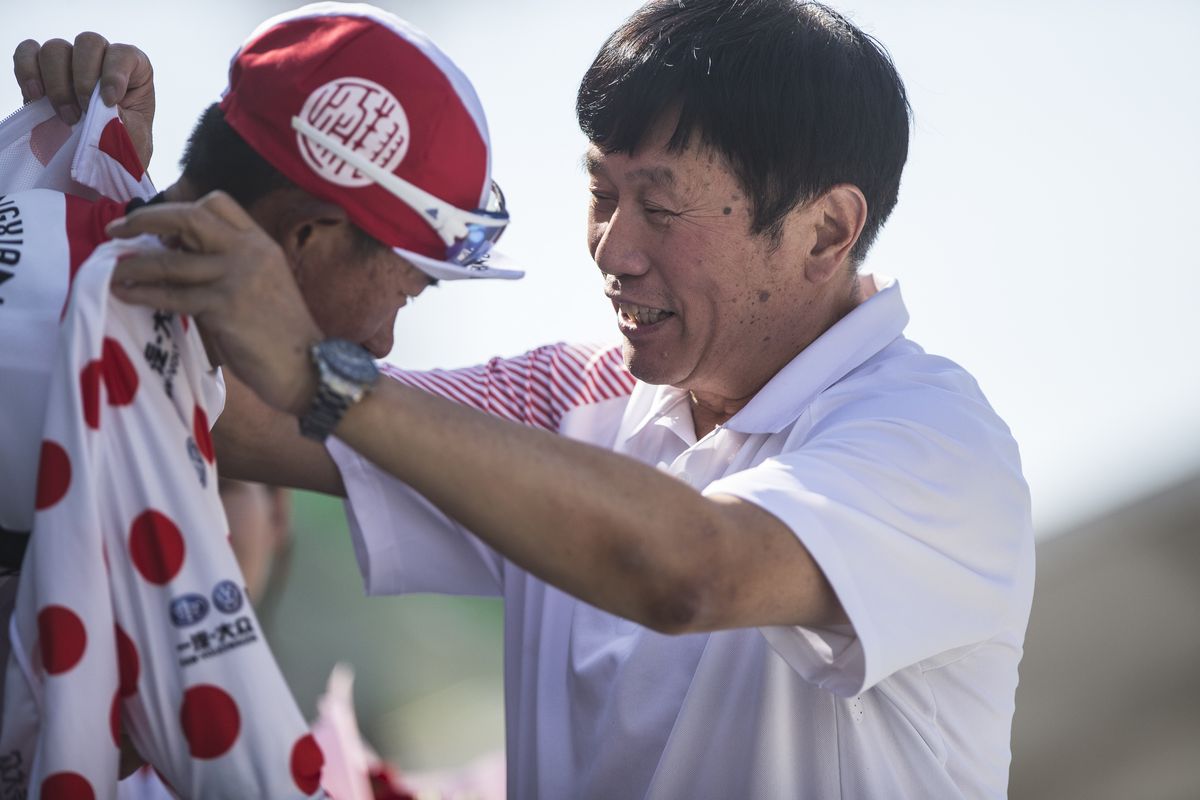 Lyu Xianjing pulls on the polka-dot jersey