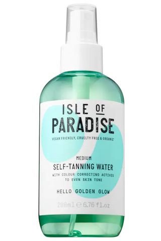 A bottle of Isle of Paradise Self-Tanning Water set against a white backgroun.