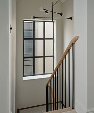 modern stairwell with black framed window