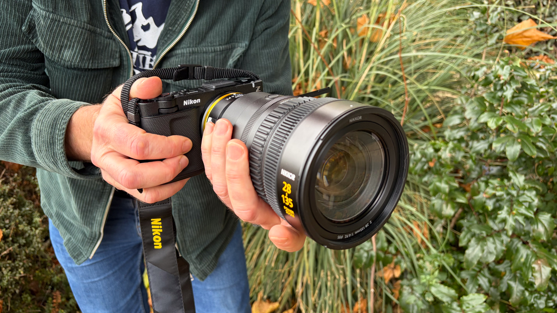 Person holding a Nikon ZR with Z 28-135mm f/4 PZ lens
