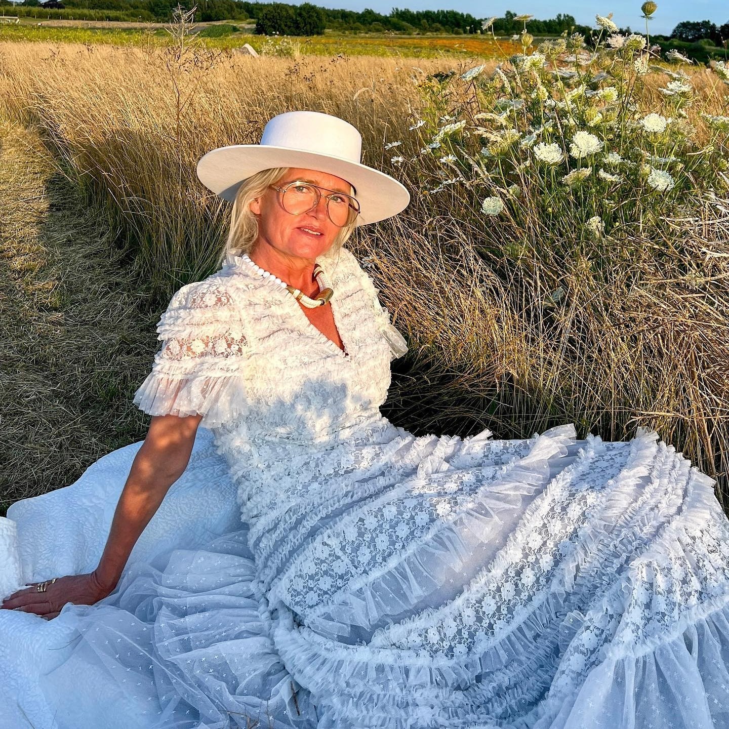 Creator @msorrig taking a photo outside with glowing skin 