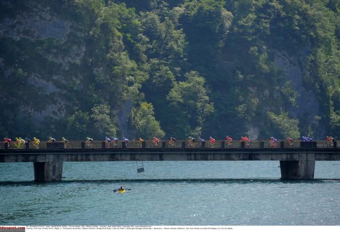 Watching the peloton pass by from the water