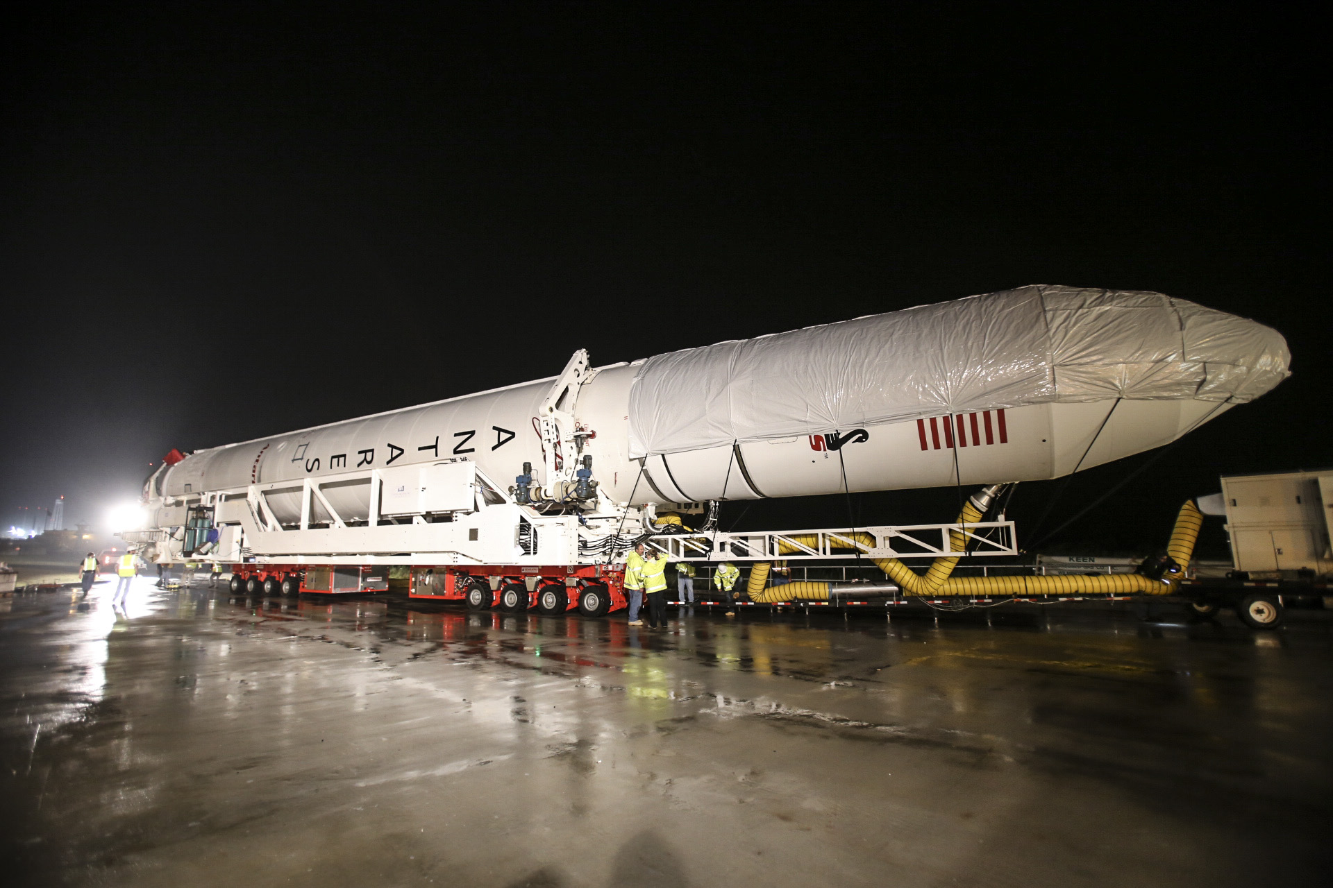 An Antares rocket built by Orbital Sciences Corp. rolls out to its launch pad at NASA&#039;s Wallops Flight Facility on Wallops Island, Virginia, on July 10, 2014 ahead of a planned July 13 launch. The mission will launch Orbital&#039;s unmanned Cygnus cargo ship t