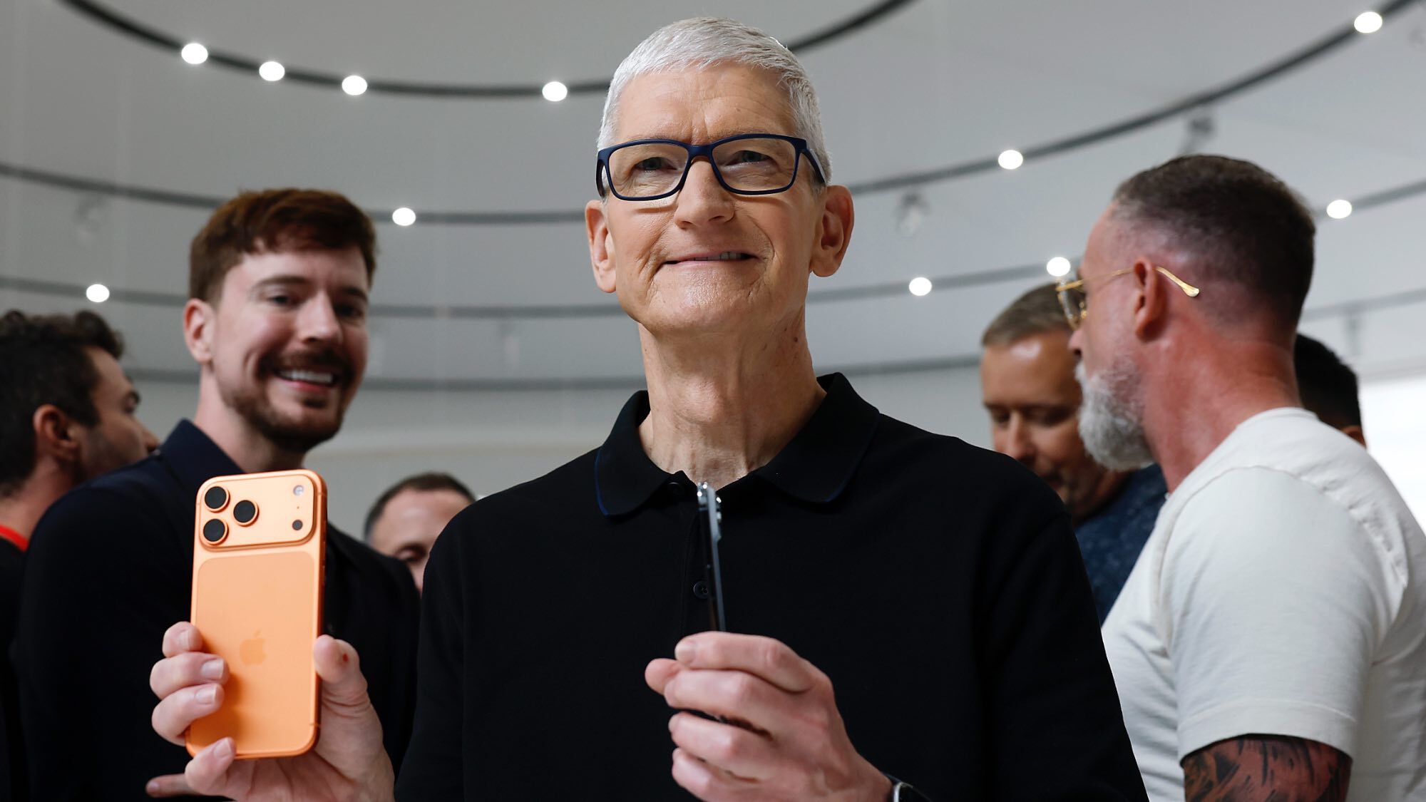 Tim Cook holding an iPhone 17 Pro Max