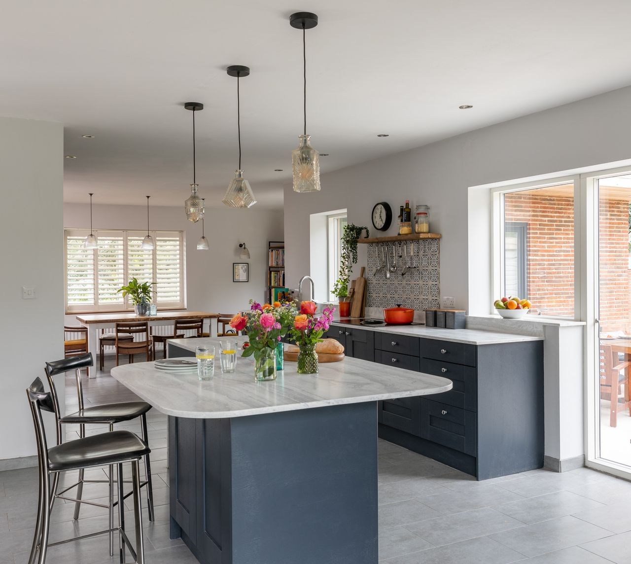 Wall and pendant lighting are from Pooky; the kitchen is from Benchmarx, with sink and tap from Blanco.