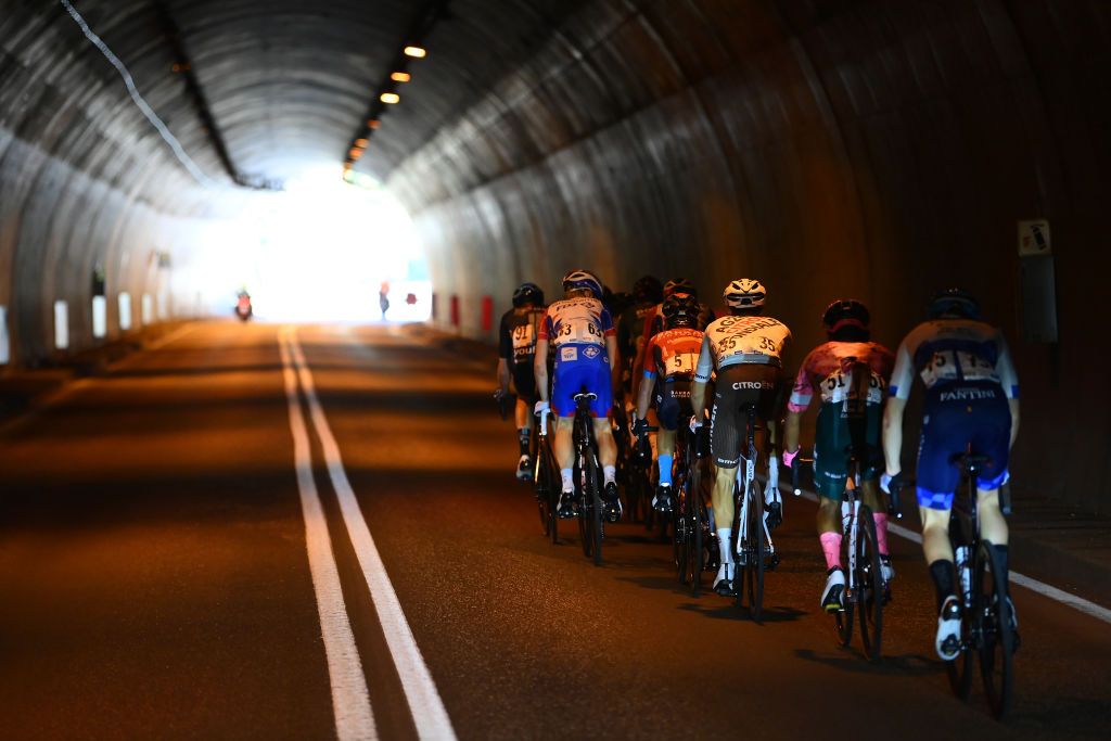 BOLZANO LANA ITALY APRIL 19 Hermann Pernsteiner of Austria and Team Bahrain Victorious Miguel ngelLpez Moreno of Colombia and Team Astana Qazaqstan Pavel Sivakov of Russia and Team INEOS Grenadiers Vadim Pronskiy of Kazahkstan and Team Astana Qazaqstan Felix Gall of Austria and AG2R Citroen Team Cian Uijtdebroeks of Belgium and Team Bora Hansgrohe Jonathan Klever Caicedo Cepeda of Ecuador and Team EF Education Easypost Matteo Badilatti of Switzerland and Team Groupama FDJ Thymen Arensman of Netherlands and Team DSM and Michael Storer of Australia and Team Groupama FDJ ccompete in the breakaway passing through a tunnel during the 45th Tour of the Alps 2022 Stage 2 a 1541km stage from PrimieroS Martino di Castrozza to Lana TouroftheAlps on April 19 2022 in Bolzano Lana Italy Photo by Tim de WaeleGetty Images