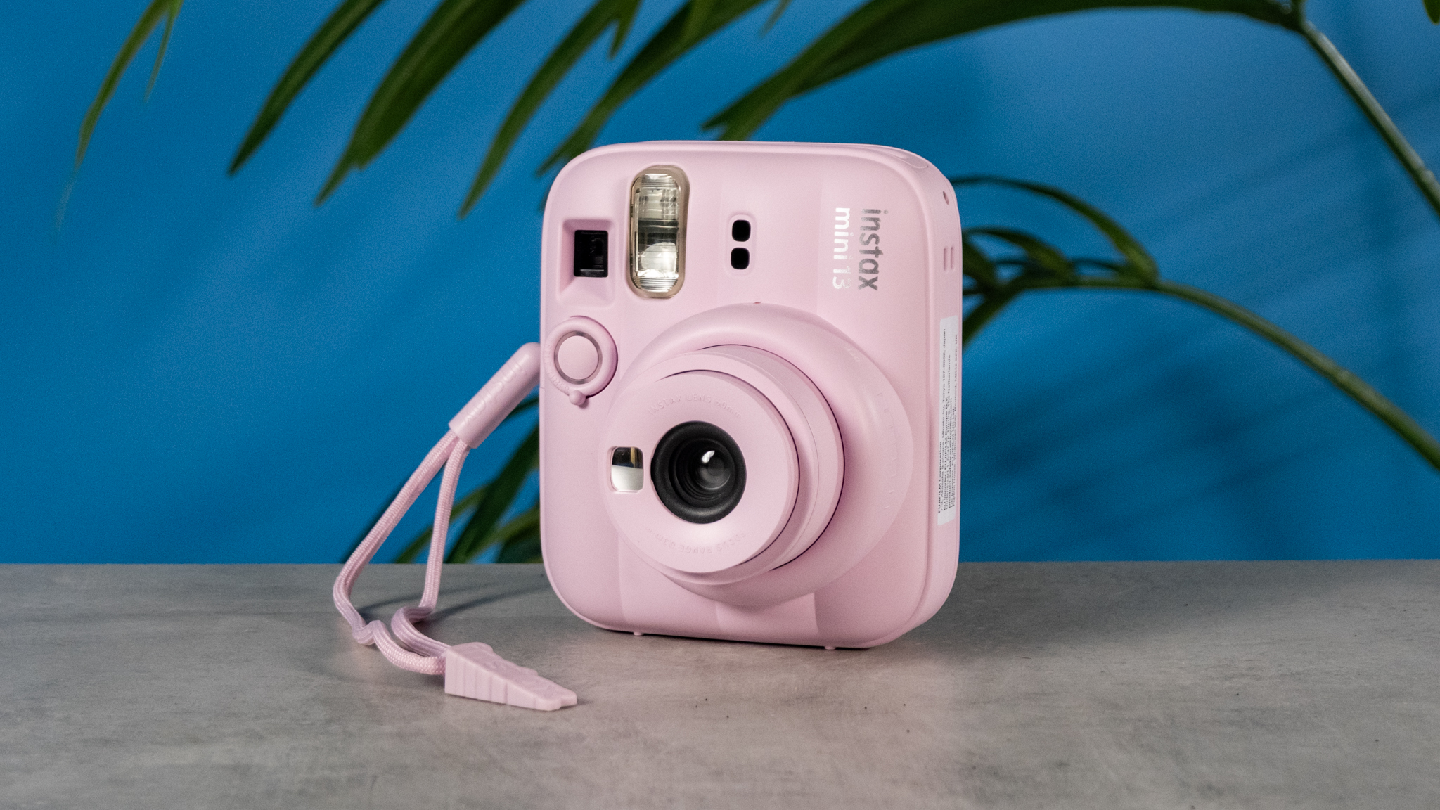 A Candy Pink Fujifilm Instax mini 13 instant camera