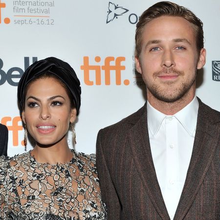 Eva Mendes poses on the red carpet with Ryan Gosling