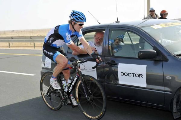 Tyler Farrar (Garmin-Barracuda) gets some treatment from the medical car.