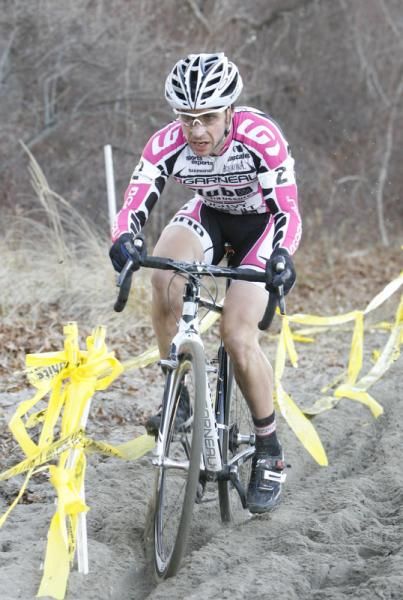 Derrick St John drives through the sand.