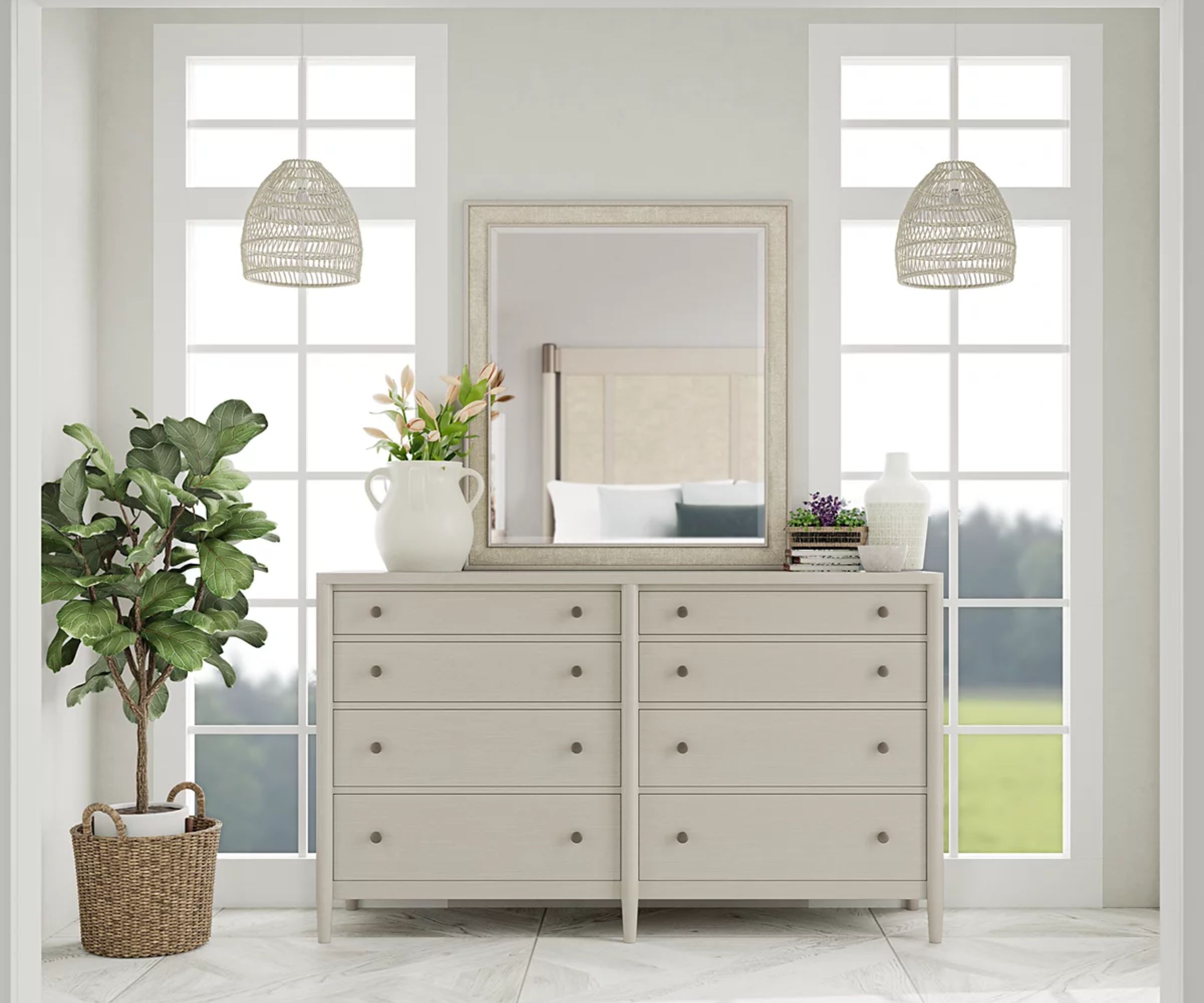 macy's pale grey wooden dresser in a neutral farmhouse bedroom styled with a mirror and vase