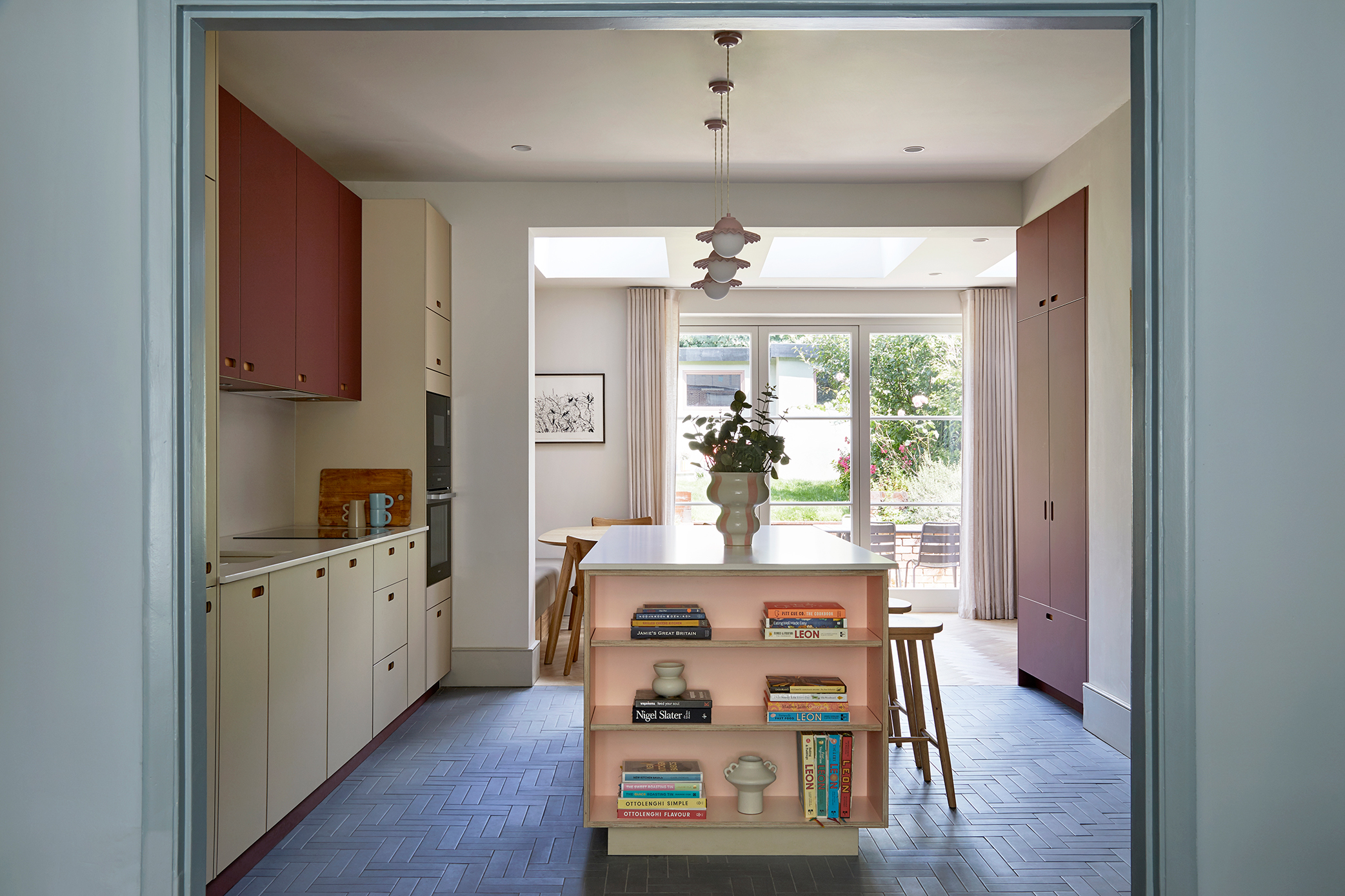A wide walk-through kitchen with no windows until you reach the back or front of the house