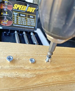 Damaged screws being removed with a Speedout drill bit
