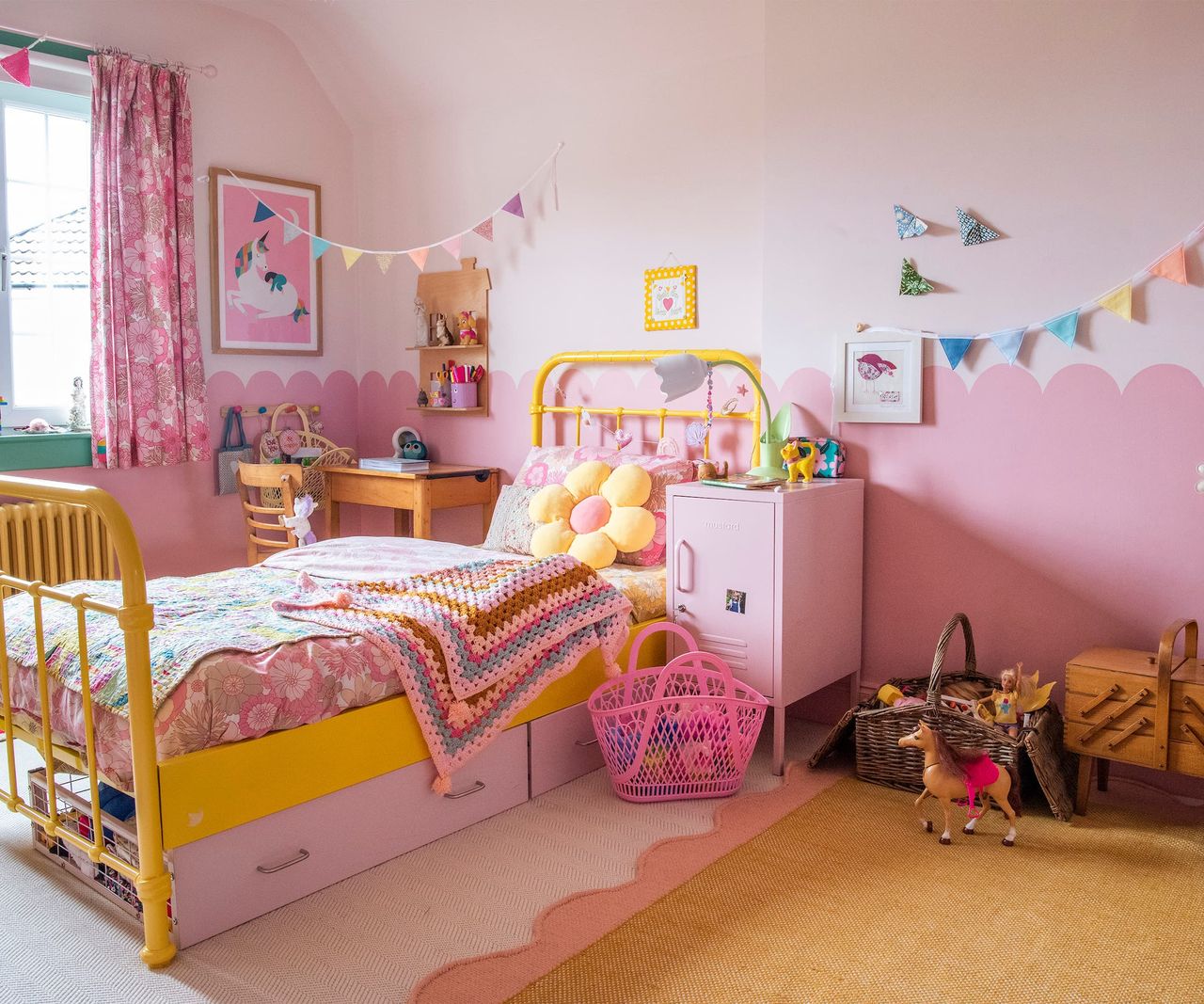 A pink bedroom with a single bed