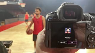 Back of a Canon camera, demonstrating the Registered People Priority mode using registered faces of a basketball team