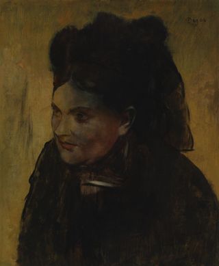 Edgar Degas' "Portrait of a Woman" was painted over top of an earlier, upside-down portrait on the same canvas. By 1922, parts of the original painting were visible as a discoloration across the later portrait.