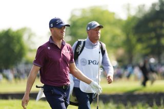 Justin Thomas of the United States and caddie Jim 'Bones' Mackay walk the sixth hole during the final round of the 2023 PGA Championship at Oak Hill Country Club