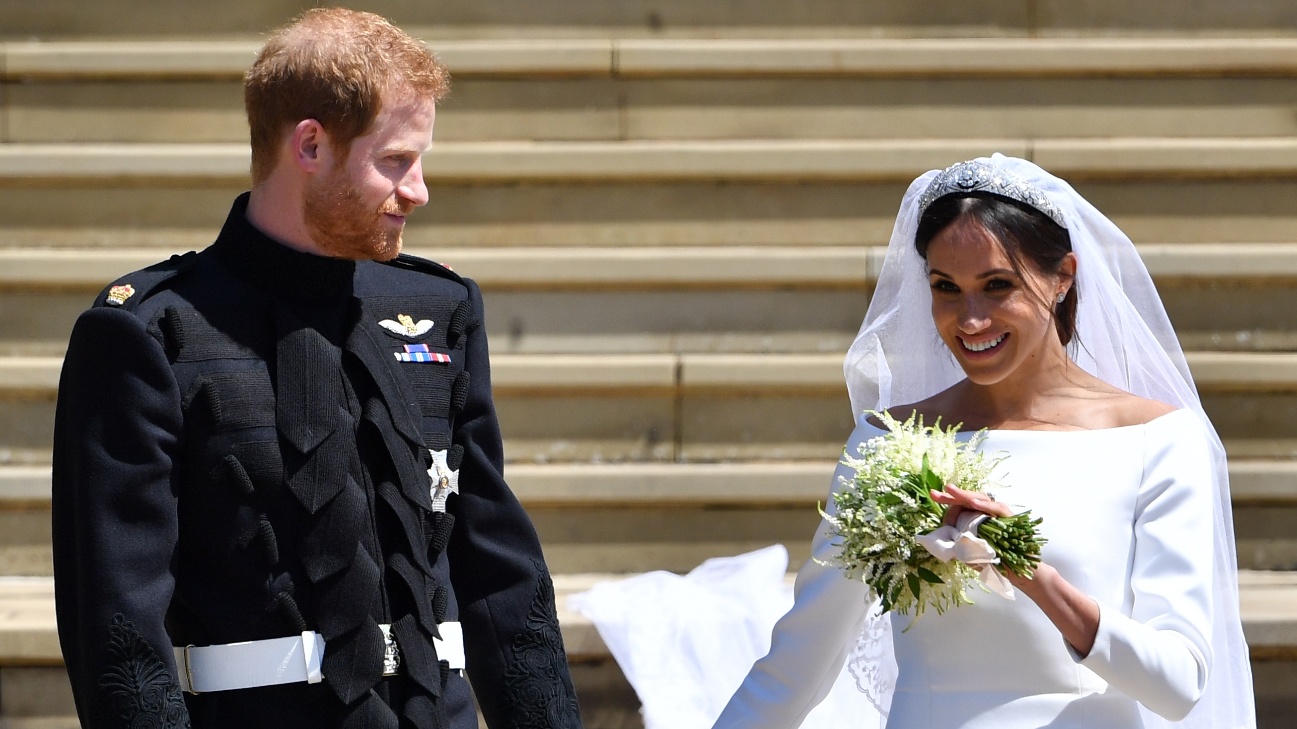 Prince Harry and Meghan, Duchess of Sussex leave from the West Door of St George's Chapel, Windsor Castle, in Windsor on May 19, 2018