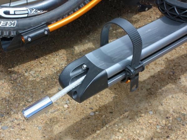 Locking cables are cleverly tucked into the trays but they're shorter than we'd like, just barely reaching through a pair of bike frames
