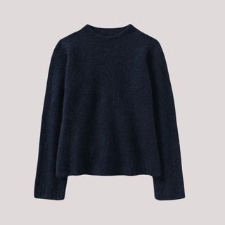 flat lay image of navy alpaca jumper