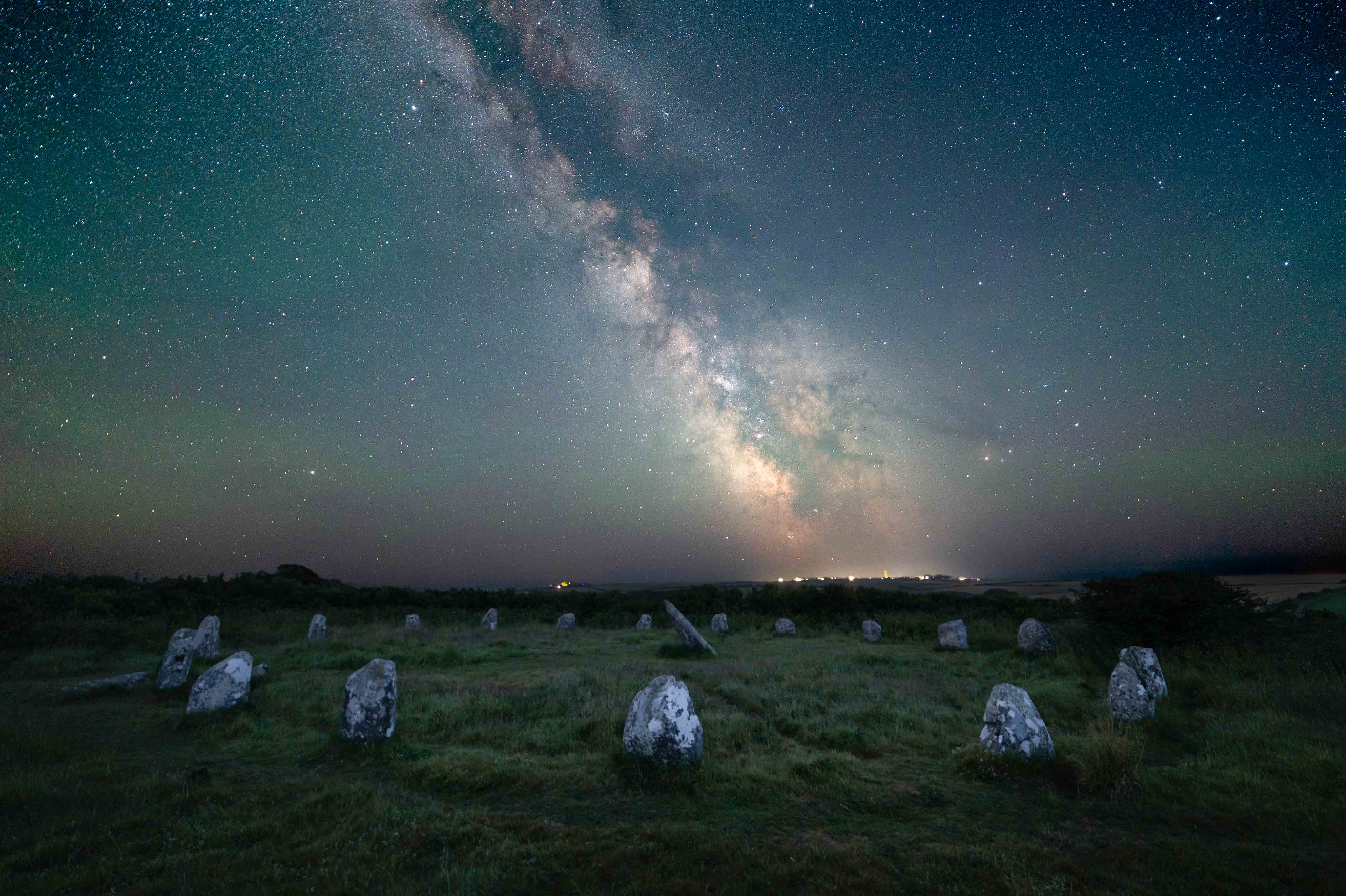 Night sky image over circle of stones