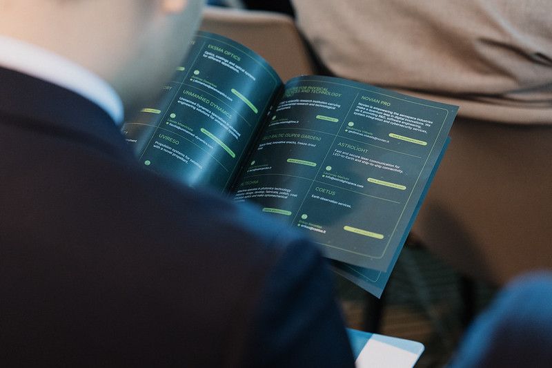 A person flipping through a magazine.