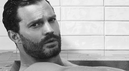 Jamie Dornan in a bath by David Sims